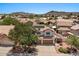 Charming two-story home with a three-car garage, solar panels, well-maintained landscaping, and mountain views at 15829 S 13Th Pl, Phoenix, AZ 85048
