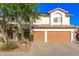 Charming two-story home featuring a well-manicured lawn, desert landscaping, and a two-car garage at 15829 S 13Th Pl, Phoenix, AZ 85048