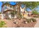 Beautiful desert-landscaped home with a two-car garage and mature trees for shade at 15829 S 13Th Pl, Phoenix, AZ 85048