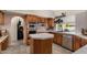 Updated kitchen showcasing wooden cabinets, tiled countertops and backsplash with stainless steel appliances at 15829 S 13Th Pl, Phoenix, AZ 85048