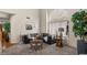 Comfortable living room featuring tile floors, an open concept, and a stylish leather couch at 15829 S 13Th Pl, Phoenix, AZ 85048