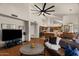 Open-concept living room with hardwood floors, vaulted ceiling, seamlessly connecting the dining and kitchen area at 15829 S 13Th Pl, Phoenix, AZ 85048