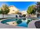 Inviting backyard pool surrounded by mature landscaping and patio furniture at 15829 S 13Th Pl, Phoenix, AZ 85048