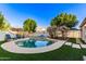 Backyard pool featuring mature trees, lounge chairs, and well-maintained landscaping at 15829 S 13Th Pl, Phoenix, AZ 85048
