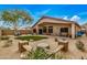 Spacious backyard with a fire pit, seating area, and landscaped with desert foliage for outdoor enjoyment at 16055 S 18Th Dr, Phoenix, AZ 85045