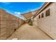 Low maintenance backyard with desert landscaping and partial shade covering at 16055 S 18Th Dr, Phoenix, AZ 85045