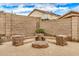 Backyard firepit area with seating, perfect for outdoor entertaining at 16055 S 18Th Dr, Phoenix, AZ 85045