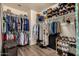 Spacious walk-in closet with shelves and rods for organized storage at 16055 S 18Th Dr, Phoenix, AZ 85045