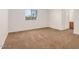Cozy bedroom with neutral carpet and a window providing natural light, creating a peaceful and relaxing atmosphere at 16602 N 25Th St # 223, Phoenix, AZ 85032