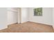 Comfortable bedroom featuring neutral carpet, closet, and a window, providing a calm and inviting personal space at 16602 N 25Th St # 223, Phoenix, AZ 85032