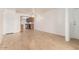Bright living room featuring hardwood floors and a glimpse of the adjacent kitchen, creating an open and inviting space at 16602 N 25Th St # 223, Phoenix, AZ 85032