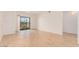 Bright living room featuring hardwood floors and a sliding glass door, offering a seamless transition to outdoor space at 16602 N 25Th St # 223, Phoenix, AZ 85032