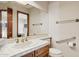 Bathroom featuring a white-tiled counter and a large mirror at 17030 N 57Th St, Scottsdale, AZ 85254