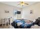 Well-lit bedroom with a desk, dresser, and comfortable bed at 17030 N 57Th St, Scottsdale, AZ 85254