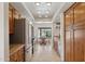 Open-concept kitchen features wooden cabinets, tiled backsplash, and stainless steel appliances with a dining area at 17030 N 57Th St, Scottsdale, AZ 85254