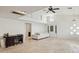Bright living room with a couch, tile flooring, and tall ceilings with a fan at 17030 N 57Th St, Scottsdale, AZ 85254