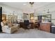 Spacious office area featuring mirrored walls, a ceiling fan, and natural light at 17030 N 57Th St, Scottsdale, AZ 85254