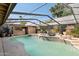 Outdoor pool with a partially enclosed structure, bar, desert landscaping, and clear blue sky at 17030 N 57Th St, Scottsdale, AZ 85254