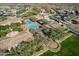 Aerial community view of resort-style amenities, including swimming pools, covered seating, and meticulously maintained landscaping at 17303 N 98Th Pl, Scottsdale, AZ 85255