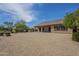 Expansive backyard with desert landscaping, a covered patio, and views at 17303 N 98Th Pl, Scottsdale, AZ 85255
