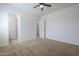 Spacious bedroom with plush carpeting and multiple doorways leading to closets and other rooms at 17303 N 98Th Pl, Scottsdale, AZ 85255