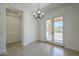 Bright dining area features tile flooring, chandelier, and French doors to outdoor space at 17303 N 98Th Pl, Scottsdale, AZ 85255