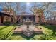 Picturesque water fountain is the focal point in backyard framed by trees and lovely architecture at 17303 N 98Th Pl, Scottsdale, AZ 85255
