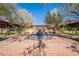 An elegant, star-shaped water fountain graces the entryway of this home, adding a touch of serenity at 17303 N 98Th Pl, Scottsdale, AZ 85255