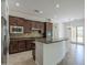 Gourmet kitchen with stainless steel appliances, granite countertops, and an island for entertaining at 17303 N 98Th Pl, Scottsdale, AZ 85255