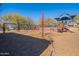 A playground area features a climbing net and a variety of other play structures and sunshades at 17303 N 98Th Pl, Scottsdale, AZ 85255