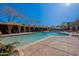 Gorgeous swimming pool featuring cabanas, ample lounge seating, and resort-style amenities at 17303 N 98Th Pl, Scottsdale, AZ 85255