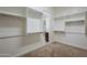 Large walk-in closet with custom shelving, offering convenient access to the en-suite bathroom at 17303 N 98Th Pl, Scottsdale, AZ 85255