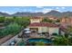 Beautiful aerial shot of a home with a private pool, spa, and patio, perfect for outdoor living and entertaining at 18500 N 95Th St, Scottsdale, AZ 85255
