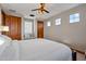 Neutral bedroom offers a bed and two windows with natural light at 18500 N 95Th St, Scottsdale, AZ 85255