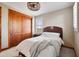 Comfortable bedroom featuring soft natural light, a bed, and a ceiling fan at 18500 N 95Th St, Scottsdale, AZ 85255