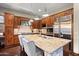 Gourmet kitchen featuring granite countertops, stainless steel appliances, and custom wood cabinetry at 18500 N 95Th St, Scottsdale, AZ 85255