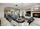 Spacious living room showcasing hardwood floors, a fireplace, an open floor plan, and seamless flow into the kitchen at 18500 N 95Th St, Scottsdale, AZ 85255