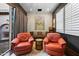 Stylish lounge featuring plush seating, modern decor, and a view to the outdoors at 18500 N 95Th St, Scottsdale, AZ 85255