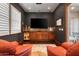 Cozy lounge area featuring a built-in bar, comfortable seating, and direct access to an outdoor patio at 18500 N 95Th St, Scottsdale, AZ 85255