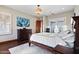 Spacious main bedroom featuring a large window, comfortable furnishings, and tasteful decor at 18500 N 95Th St, Scottsdale, AZ 85255