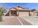 Charming single-story home with desert landscaping, covered porch, and a two-car garage at 21181 N 80Th Ln, Peoria, AZ 85382