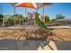 Community playground featuring slides, climbing structures, and shaded seating for relaxing playdates at 21181 N 80Th Ln, Peoria, AZ 85382