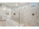 Modern bathroom with walk-in shower showcasing elegant marble tiling and glass enclosure at 22660 E Pegasus Pkwy, Queen Creek, AZ 85142