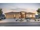 Beautiful single-story home featuring a three-car garage and desert landscaping at 22660 E Pegasus Pkwy, Queen Creek, AZ 85142
