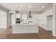A modern kitchen featuring bright white cabinets, an island and recessed lighting at 22660 E Pegasus Pkwy, Queen Creek, AZ 85142