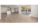Spacious living room with an open concept design to the kitchen and covered patio at 22660 E Pegasus Pkwy, Queen Creek, AZ 85142