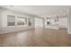 Bright, open-concept living space featuring wood look floors and abundant natural light at 22660 E Pegasus Pkwy, Queen Creek, AZ 85142