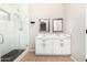 Bathroom features and sinks, glass-enclosed shower, and tile flooring at 2300 E Austin Dr, Gilbert, AZ 85296