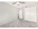 This bedroom contains standard closet doors and a secondary doorway into another part of the house at 2300 E Austin Dr, Gilbert, AZ 85296