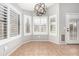 Cozy breakfast nook with lots of natural light, decorative chandelier, and tile flooring at 2300 E Austin Dr, Gilbert, AZ 85296